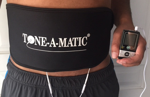 Man wearing Tone-A-Matic Abdomina/Back Belt that is connected to a TENS massager